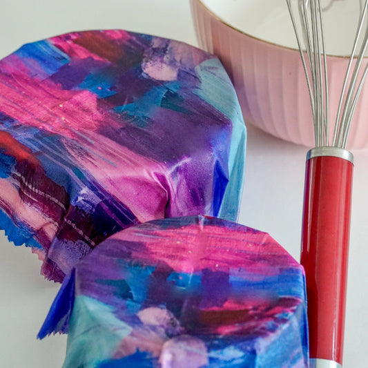 A bowl covered with Superwrap’s upcycled beeswax wrap in the ‘Blush Blossom’ design