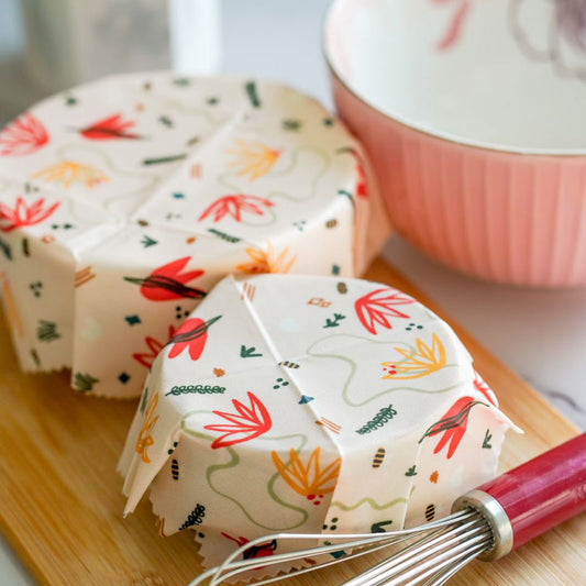 A bowl covered with Superwrap’s upcycled beeswax wrap in the ‘Autumn Bloom’ design